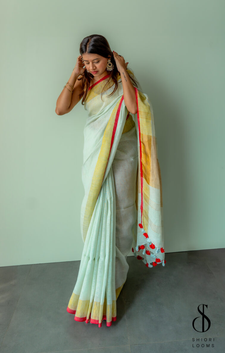 Handwoven Pastel Green Linen Saree with Golden Borders
