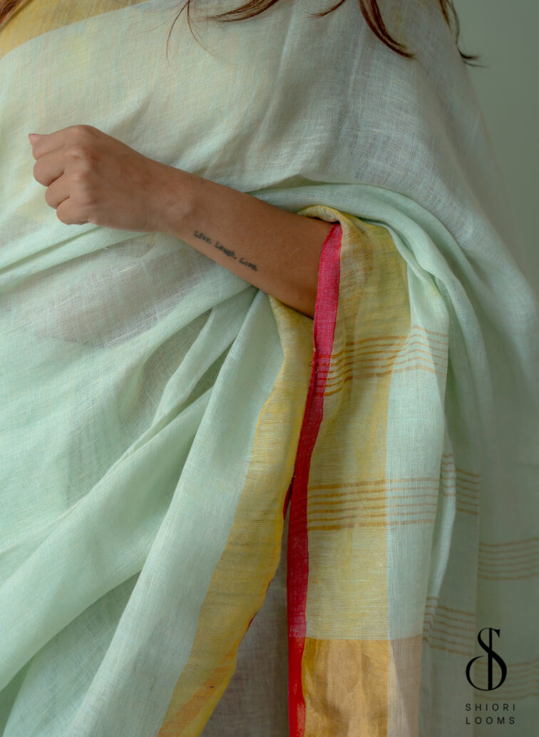 Handwoven Pastel Green Linen Saree with Golden Borders