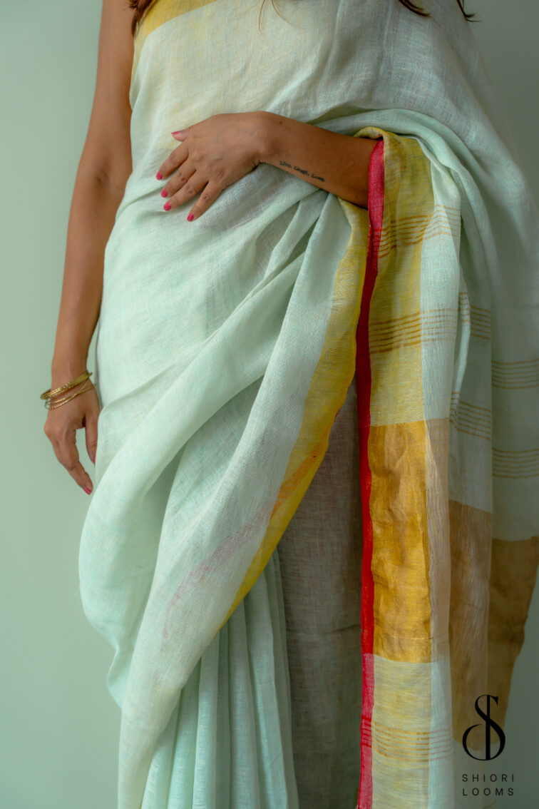 Handwoven Pastel Green Linen Saree with Golden Borders
