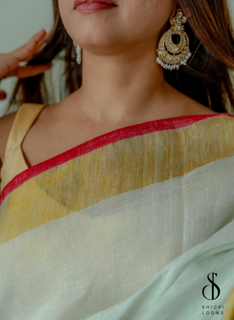 Handwoven Pastel Green Linen Saree with Golden Borders