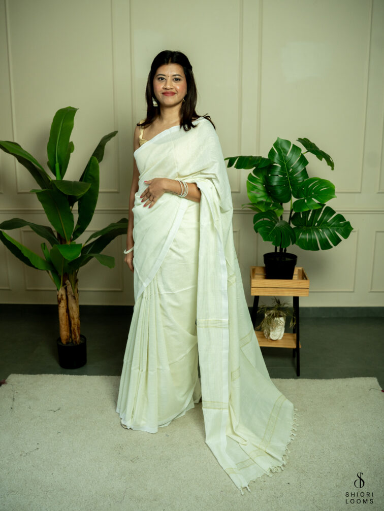 Handwoven white Cotton saree with gold zari stripes
