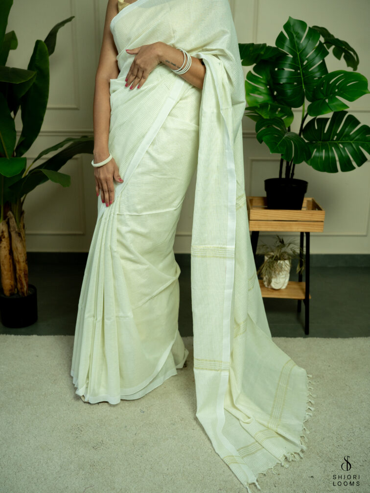 Handwoven white Cotton saree with gold zari stripes