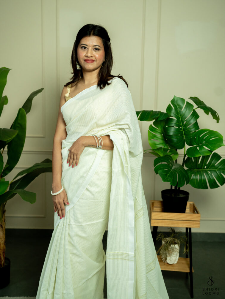 Handwoven white Cotton saree with gold zari stripes