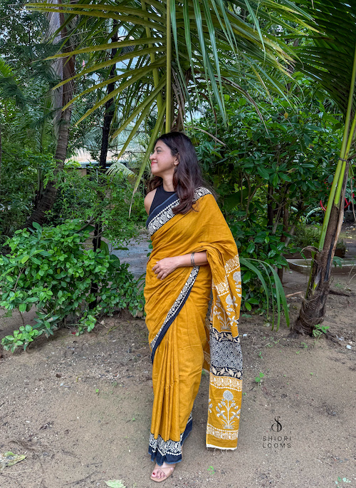Handblock Printed Mul Cotton Saree in Mustard with Black Border