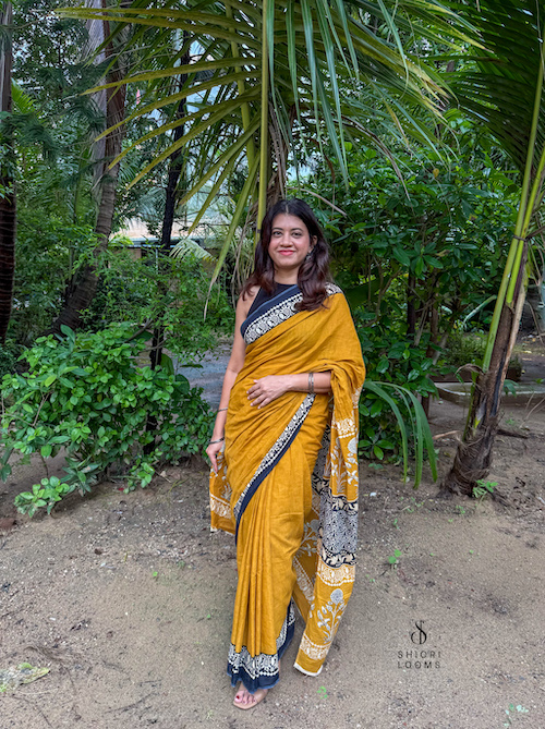 Handblock Printed Mul Cotton Saree in Mustard with Black Border