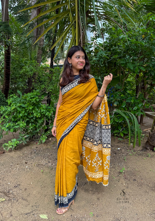 Handblock Printed Mul Cotton Saree in Mustard with Black Border